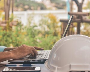 Construction worker on laptop
