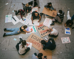 group creating signs for equal rights protest
