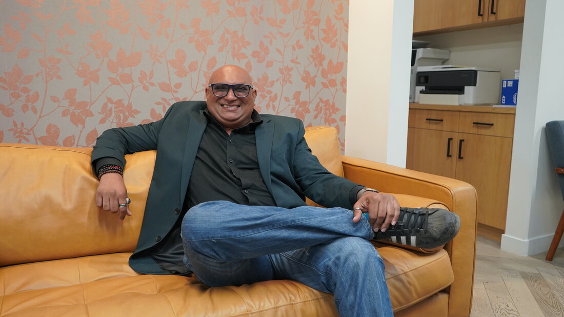 Ravi Pariah sitting on couch