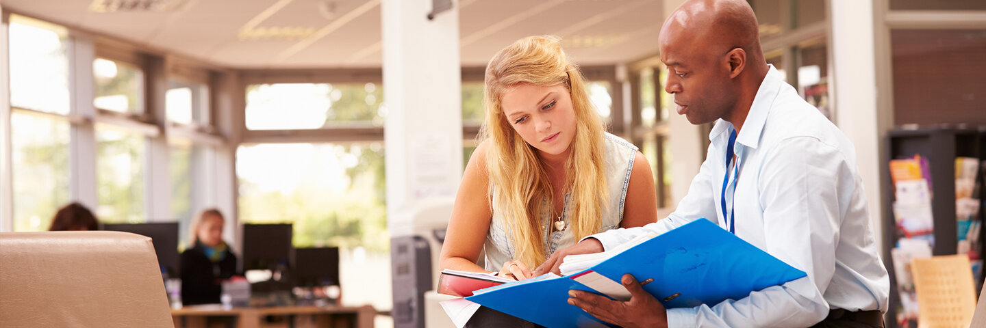 college counselor advising a student