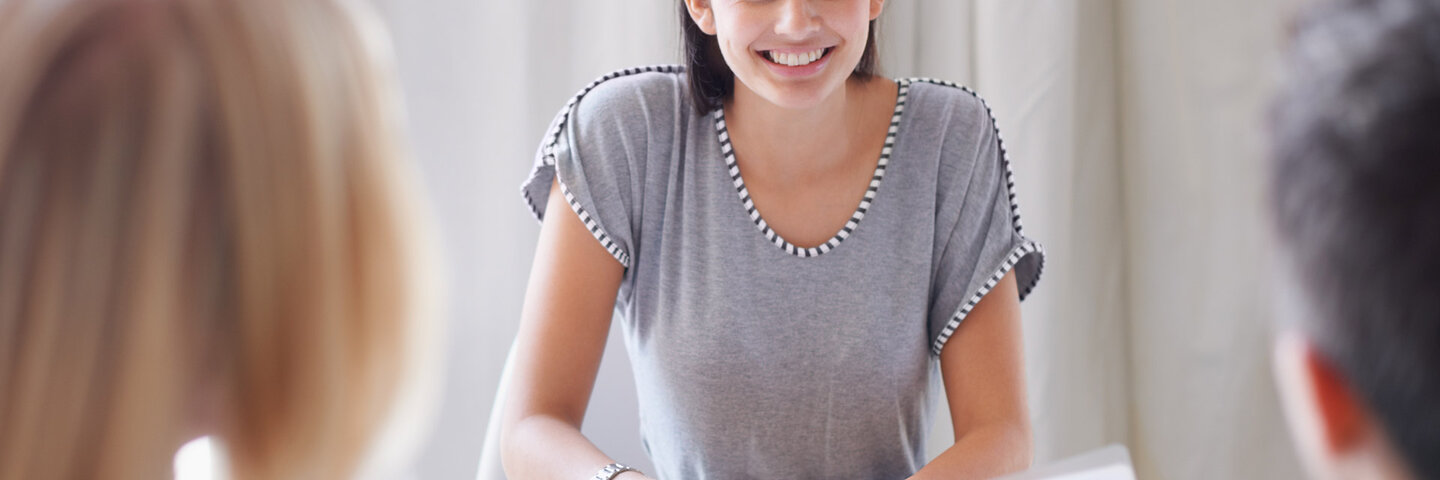 business woman meeting with client couple