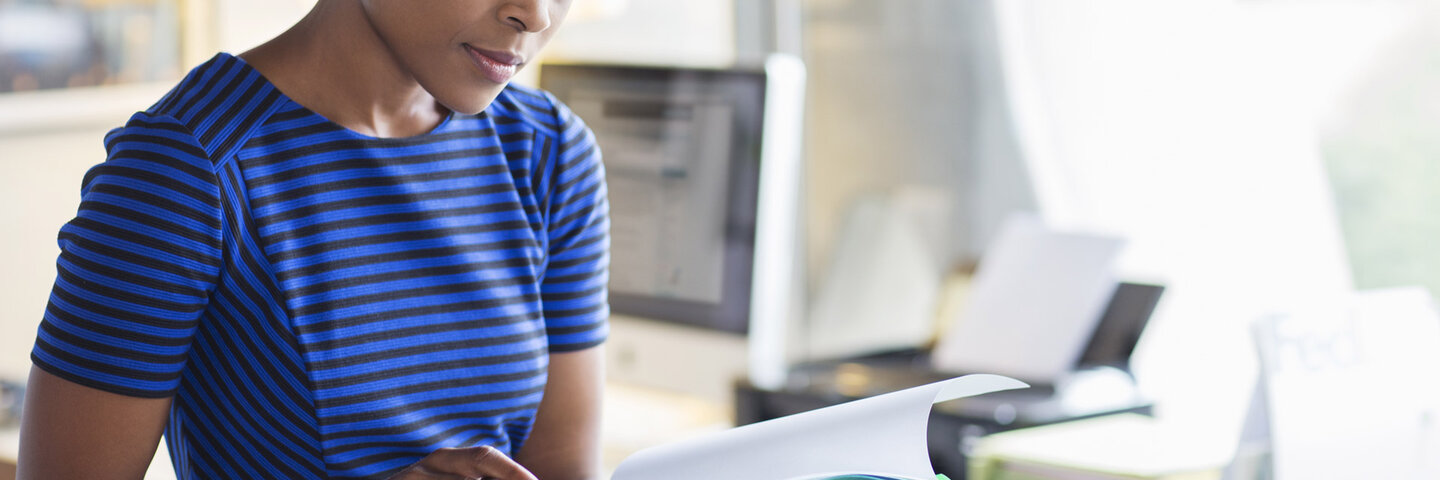 woman looking at paperwork