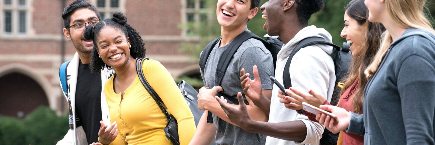 group of high school students walking outside with backpacks