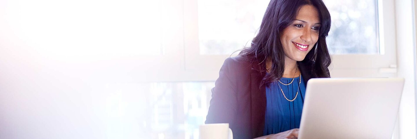 Young business woman working on a laptop