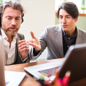 two producers discussing a project