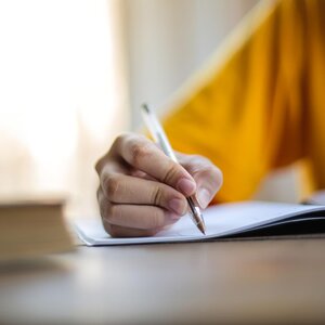 hand writing in a notebook